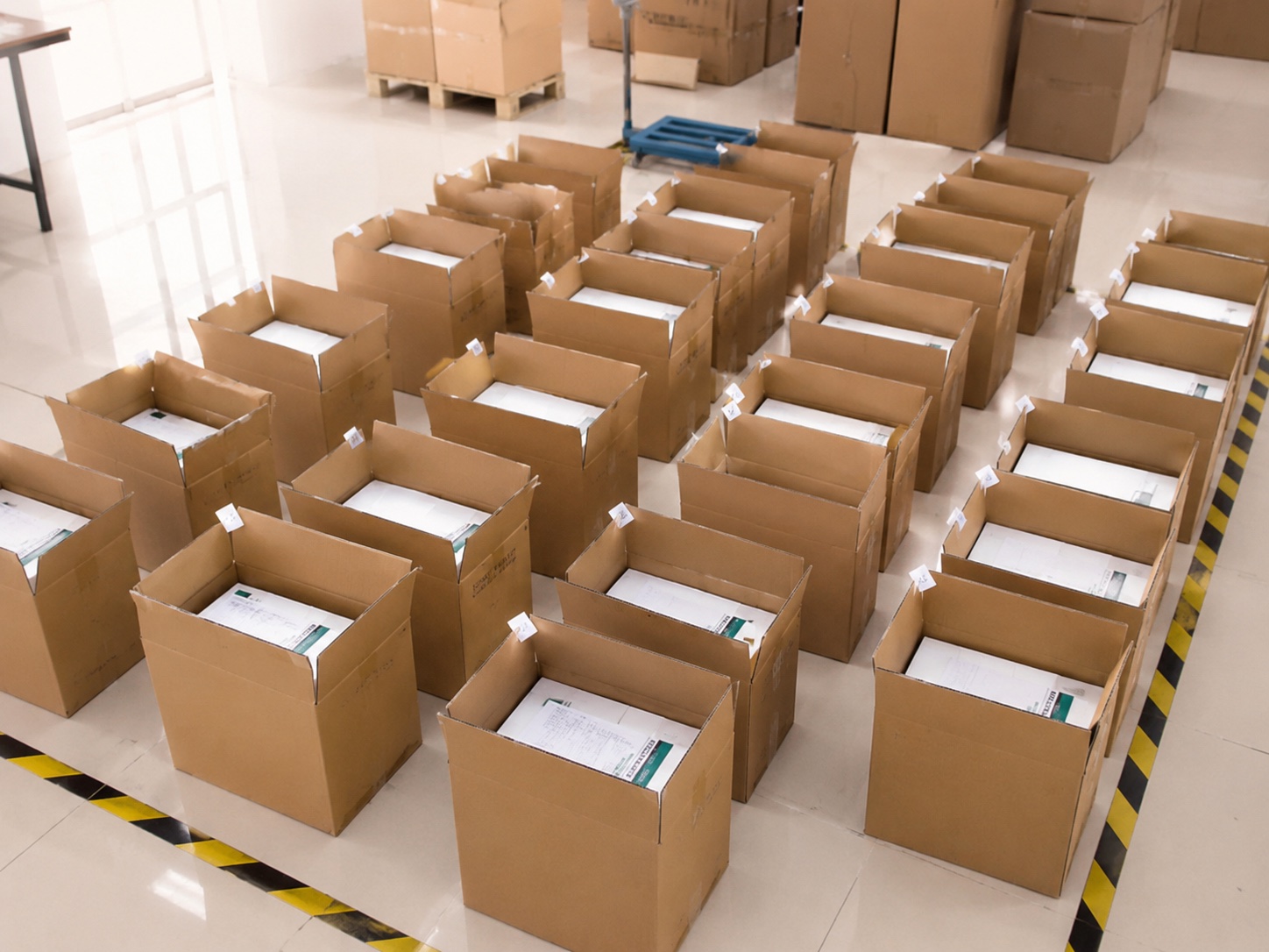 Open cartons arranged for multi-supplier order checking